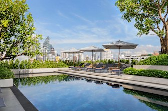 City skyline views from the rooftop pool.