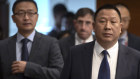 Song Liuping, right, chief legal officer of Huawei, arrives for a press conference at Huawei's campus in Shenzhen on Thursday.