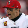 ampa Bay Buccaneers quarterback Tom Brady (12) tries to fire up the team during the second half of an NFL divisional round playoff football game against the Los Angeles Rams Sunday, Jan. 23, 2022, in Tampa, Fla. (AP Photo/Mark LoMoglio)