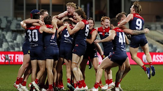 The Demons celebrate taking out the minor premiership.