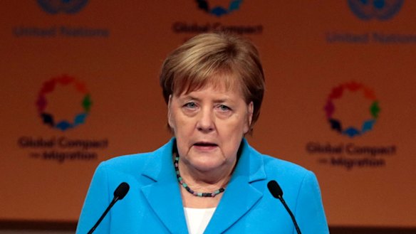 German Chancellor Angela Merkel addresses delegates in Morocco.
