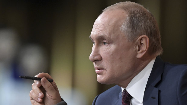 Russian President Vladimir Putin attends his annual news conference in Moscow.