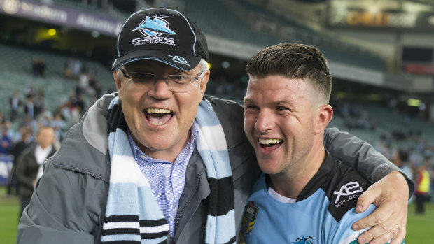 Pressing the flesh: Prime Minister Scott Morrison hugs Chad Townsend after his heroics at Allianz Stadium.