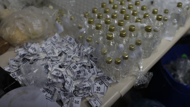 Drugs and packaging seized during the police raid are displayed for the press at the city police headquarters in Rio de Janeiro.