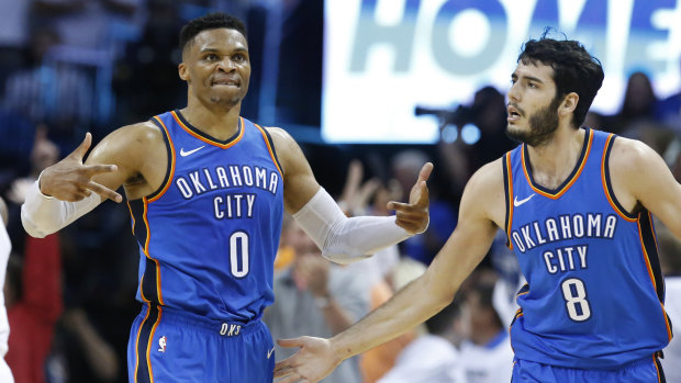Back in the contest: Russell Westbrook, left, celebrates with Alex Abrines after hitting a basket.