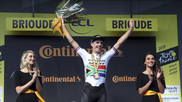 Success: Daryl Impey celebrates on the podium after winning the ninth stage of the Tour de France.