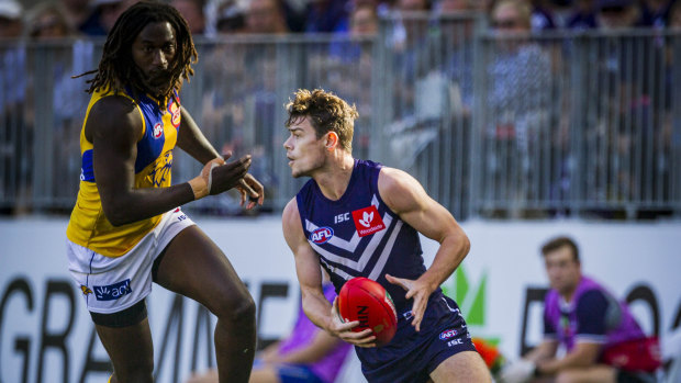Nic Naitanui of the West Coast Eagles and Lachie Neale of the Fremantle Dockers .