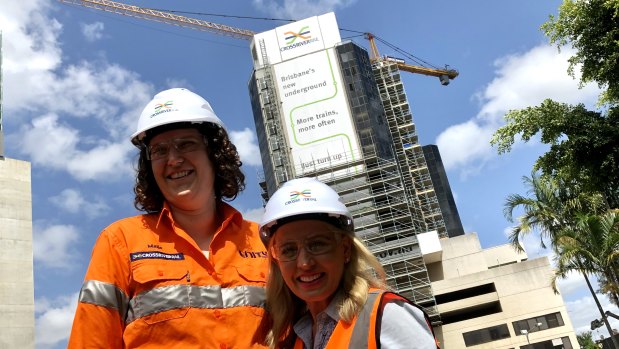 Maija Bicevskis, a project engineer from Brisbane who returned home to work on Cross River Rail, and minister Kate Jones at the demolition of Hotel Jen, part of the Brisbane Transit Centre on Roma Street.