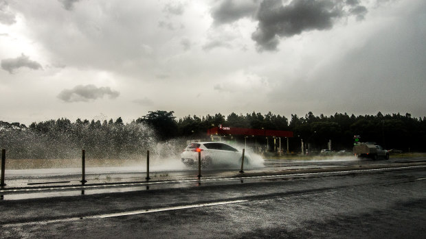 Torrential rain forced cars to pull onto the side of the road on the Bass Highway, near Koo Wee Rup.