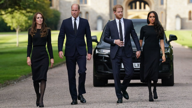 Catherine, the Princess of Wales, Prince William, the Prince of Wales, Prince Harry, the Duke of Sussex and Meghan, the Duchess of Sussex, walk towards the crowds at Windsor Castle.