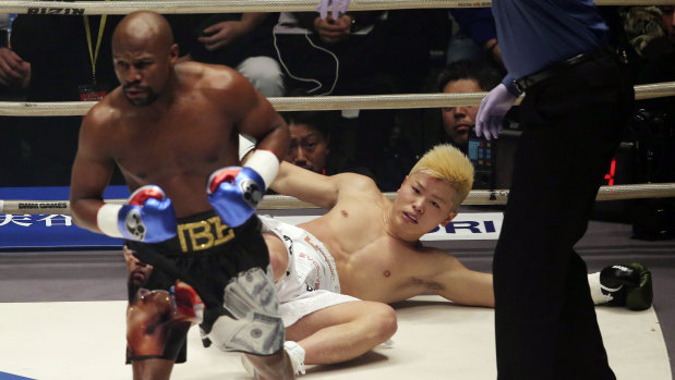 Over and out: Floyd Mayweather proved far too strong for Japanese kickboxer Tenshin Nasukawa.