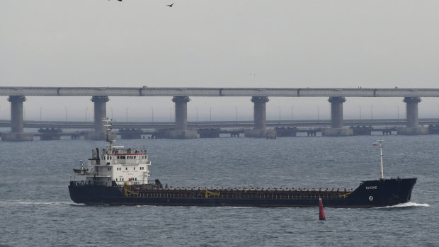 A ship travels near the Kerch bridge in the Kerch Strait.