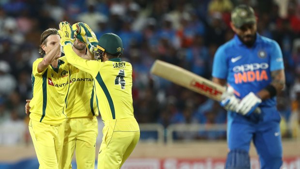 Adam Zampa celebrates his wicket of Virat Kohli during a game in India in 2019.