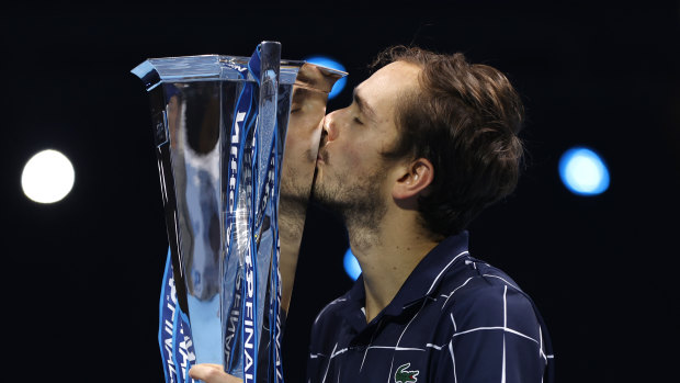 Daniil Medvedev lifts the ATP Finals trophy.