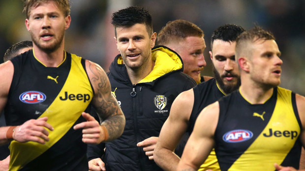 Trent Cotchin runs off the ground with teammates at half-time in the match on Friday against Collingwood.