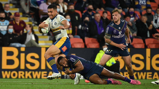 Will Penisini breaks a tackle against the Storm last month.