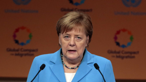 German Chancellor Angela Merkel addresses delegates in Morocco.