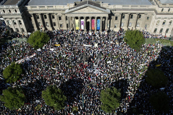 A massive crowd gathers for the anti-war rally outside the State Library.