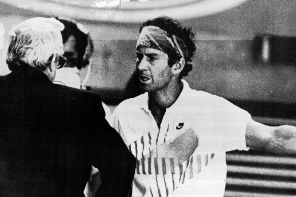 McEnroe argues with tournament director Ken Farrar.
