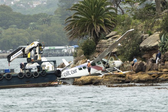The plane was winched onto the Shark Island rocks after passengers were evacuated.