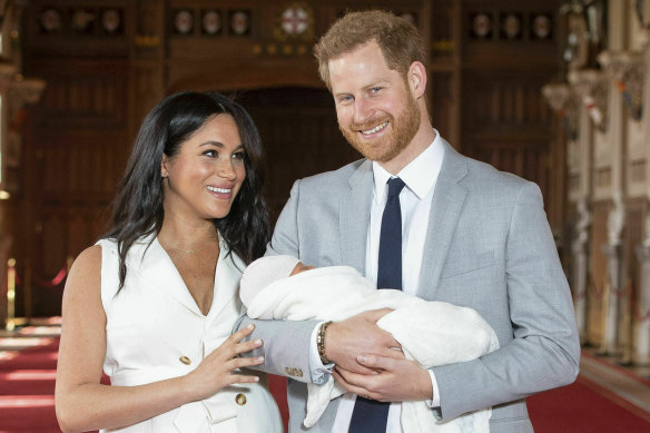 Harry and Meghan with their newborn son in St George's Hall at Windsor Castle in May.