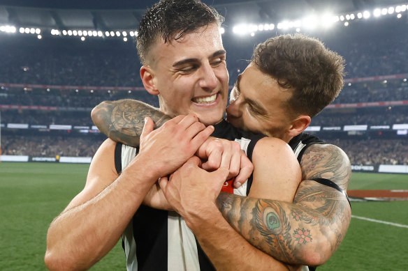 Elliott (right) with Nick Daicos after Collingwood’s preliminary final win.