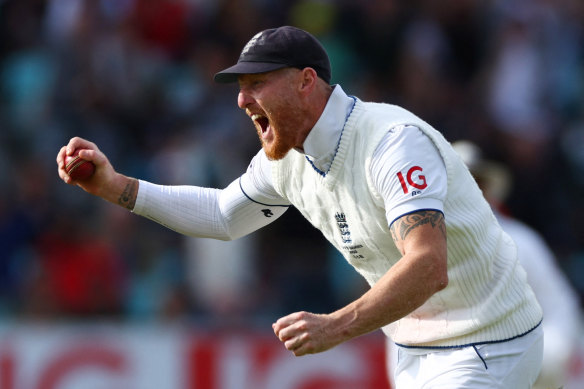 England’s Ben Stokes celebrates after taking a catch to dismiss Australia’s Pat Cummins.