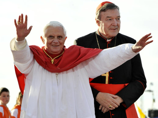 Pope Benedict waves as he walks with Cardinal George Pell on World Youth Day welcome in Sydney in 2008.