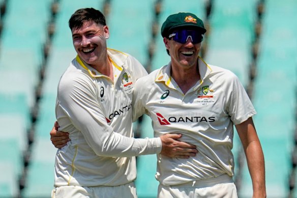 Matt Renshaw and Pat Cummins celebrate on day five in Durban.