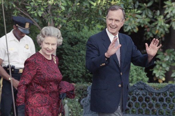 George H.W. Bush escorts the Queen from the White House to a helicopter en route to Baltimore to watch her first major league baseball game.