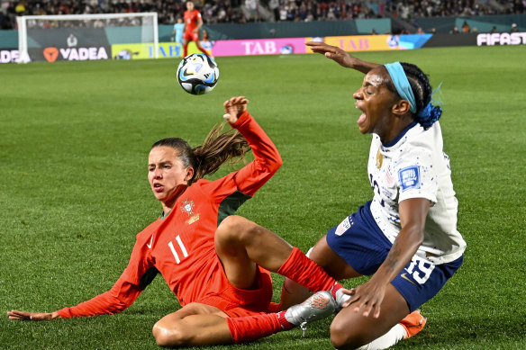United States’ Crystal Dunn, right, and Portugal’s Tatiana Pinto fight hard for possession.