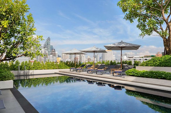 City skyline views from the rooftop pool.