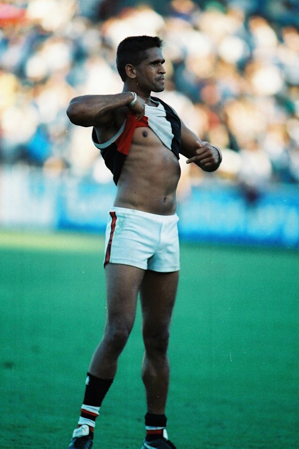 Moments before and after St Kilda footballer Nicky Winmar raises his jumper in response to racial taunts from Collingwood fans at Victoria Park on Saturday 17 April 1993.