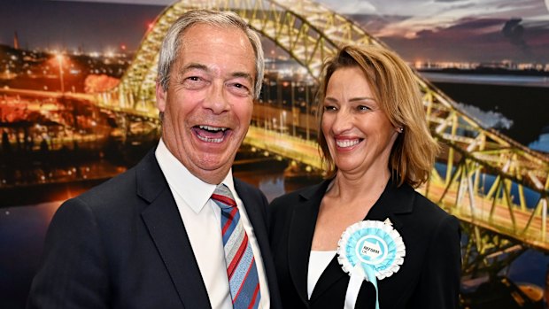 Nigel Farage and Sarah Pochin of the Reform Party celebrate as the latter is declared the winner of the Runcorn and Helsby byelection.