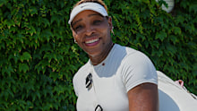 Serena Williams smiles after a training session at the All England Lawn Tennis and Croquet Club.