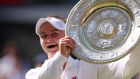 Barbora Krejcikova of Czechia lifts the trophy following victory against Jasmine Paolini of Italy.