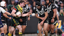Kalyn Ponga of New Zealand holds his arm.