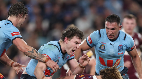 Liam Martin smashes Reuben Cotter.