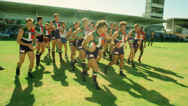 Ben Allan leads the Dockers onto East Fremantle Oval for their first match against an AFL side, Essendon.