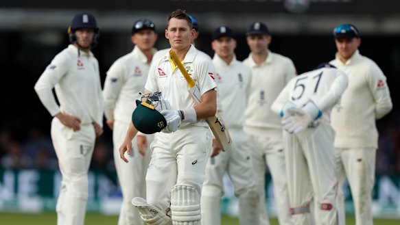 Australia's Marnus Labuschagne walks off the pitch after being given out caught by Joe Root off the bowling of Jack Leach. 