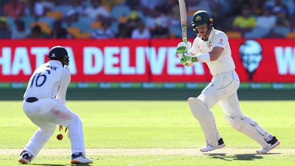 Tim Paine wields the willow in Brisbane... he needs to go on with things on day two at the Gabba.