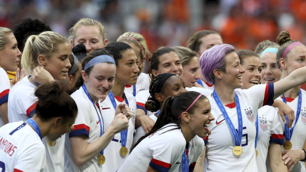 Invitation retracted?: Megan Rapinoe, centre, celebrates the United States' victory with her teammates after the Women's World Cup soccer final  against the Netherlands at the Stade de Lyon.