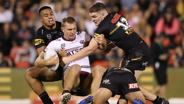 Manly’s Tom Trbojevic is rounded up by the Penrith defence.