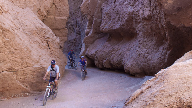 Little margin for error: mountain-biking through Devil's Throat gorge in Chile's Atacama Desert.
