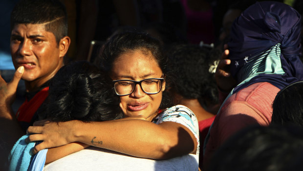 Women embrace outside Anisio Jobim Prison Complex after a deadly riot erupted among inmates in Manaus in the northern state of Amazonas, Brazil.