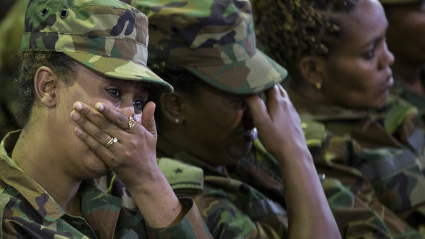 Members of the military shed a tear during a state ceremony for assassinated army chief General Seare Mekonnen.