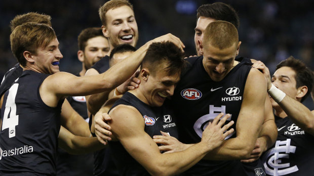 Carlton celebrate debutante Josh Deluca's goal on their way to a 24-point win against Gold Coast. 