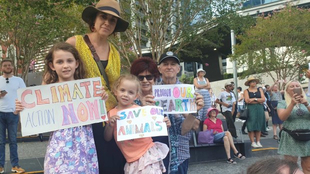 Kathryn McCarthy, with daughters Zara (7) and Juliet (4) and her parents at the climate protest in King George Square.