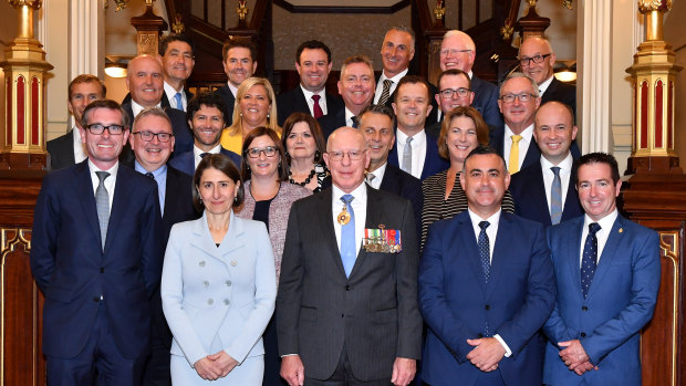 NSW Premier Gladys Berejiklian and her new 24-member ministry pose with NSW Governor David Hurley at Government House in Sydney.