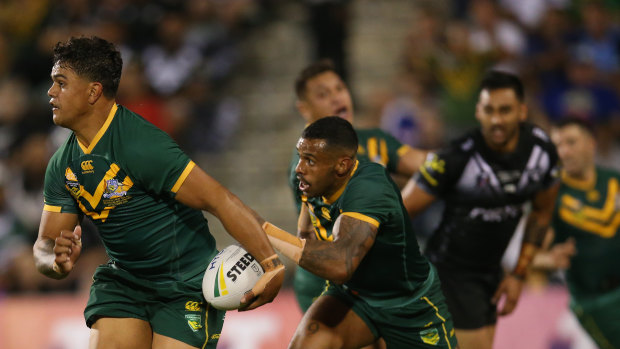 In green and gold: Latrell Mitchell on the fly for Australia in Wollongong against New Zealand.